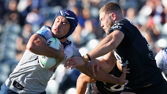 Jahrome Hughes tries to push off the Warriors at Central Coast Stadium.