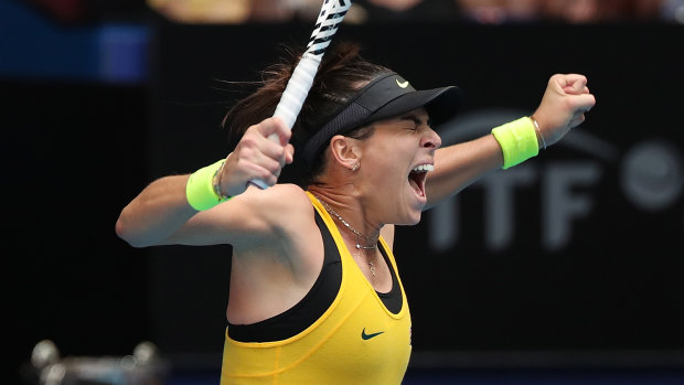 All square: Ajla Tomljanovic celebrates after levelling the Fed Cup tie for Australia with victory over France's Pauline Parmentier.