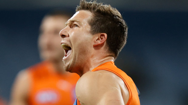 Giants star Toby Greene celebrates a goal against the Cats.