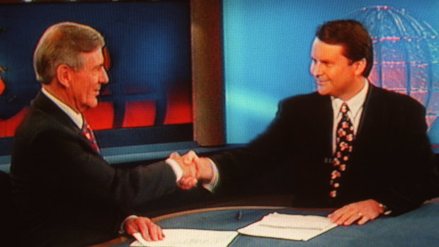 Tony Jones shaking Brian Naylor's hand during his final news bulletin on Channel Nine.