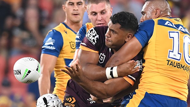 Tevita Pangai Jnr charges forward for the Broncos.