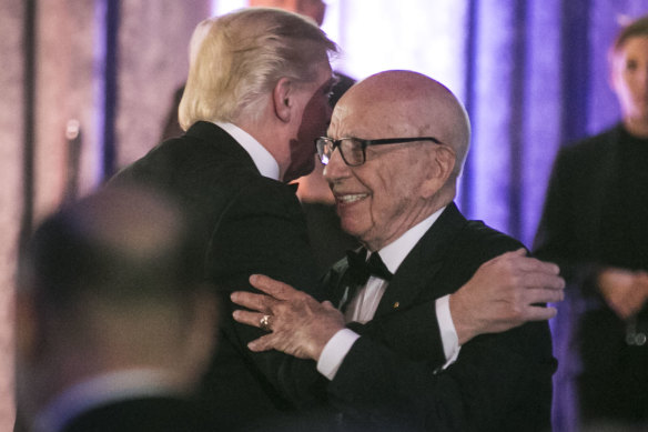 Rupert Murdoch and then US president Donald Trump embrace at a function in 2017.
