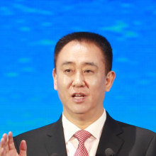 Evergrande founder Hui Ka Yan  delivers the keynote speech in November 2019 at a summit aimed towards promoting a new energy vehicle  development.