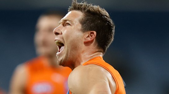 Giants star Toby Greene celebrates a goal against the Cats.