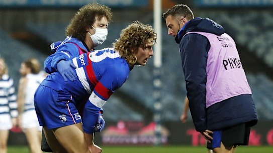 Medical staff attend to Aaron Naughton.