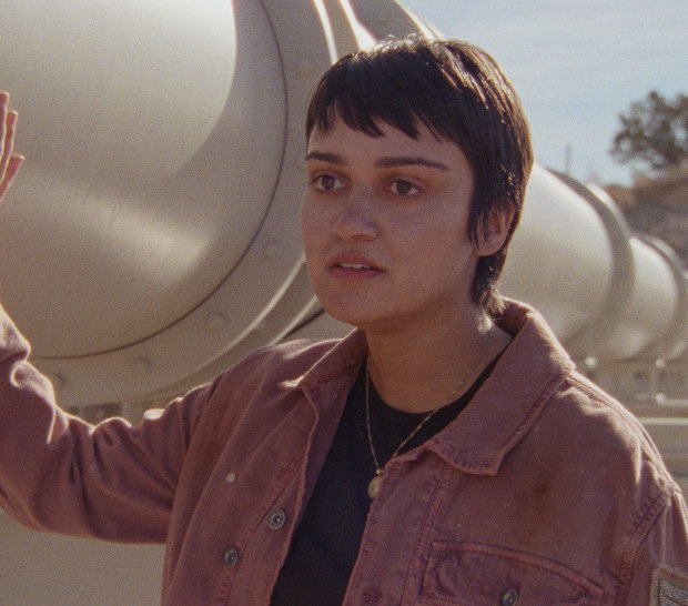 Ariela Barer, who co-wrote the script, plays a Latina who is mourning the sudden death of her mother in a heatwave in How to Blow Up a Pipeline.