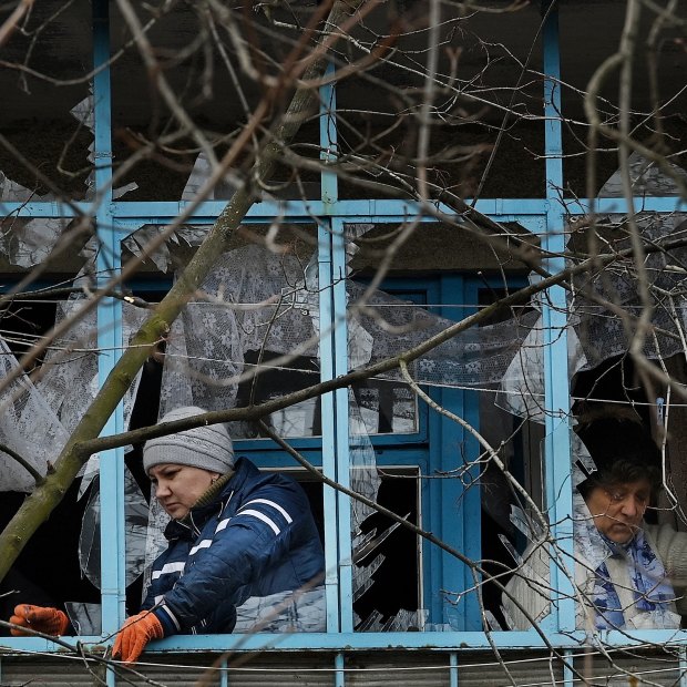 Residents clean up the damage from a missile attack at 2.40 am on Monday 14th of March.