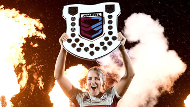 Ali Brigginshaw holds the Origin shield aloft. 