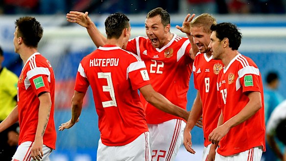Big win: Artem Dzyuba (22) and teammates celebrate after his goal. 