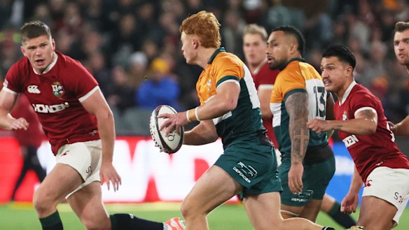 Tane Edmed of the AUNZ Invitational XV runs at Owen Farrell