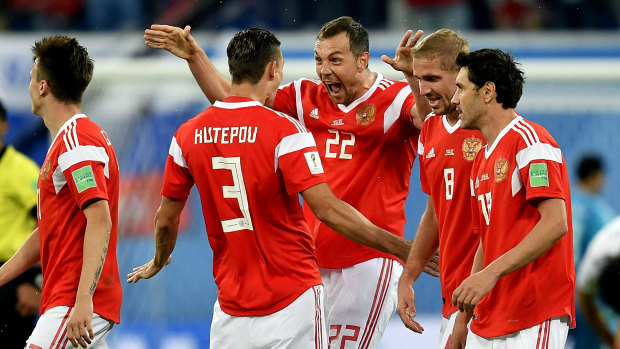 Big win: Artem Dzyuba (22) and teammates celebrate after his goal. 