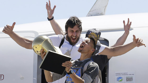 Steph Curry and Andrew Bogut celebrate their NBA title in 2015.