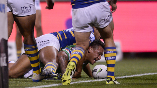 Josh Papalii crosses for the Raiders in their comfortable win over the Eels on Sunday.