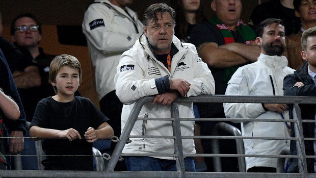 That's entertainment: Russell Crowe  watches his beloved Rabbitohs chalk up another finals win. 