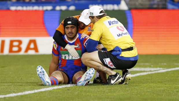 Another head injury: Sione Mata\'utia in tended by support staff after the injury.