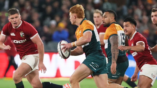 Tane Edmed of the AUNZ Invitational XV runs at Owen Farrell