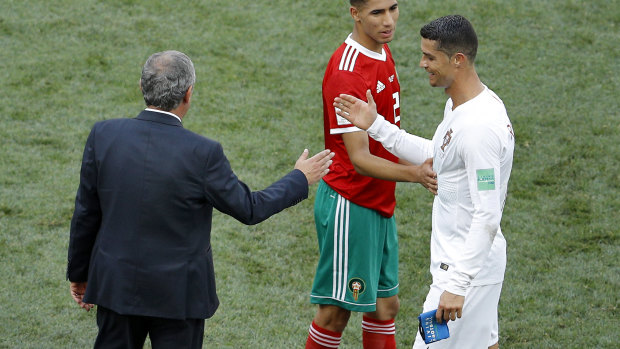 Star man: Santos and Cristiano Ronaldo shake hands after Portugal's win over Morocco.