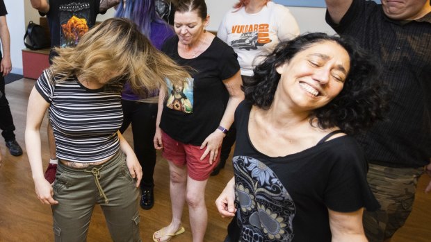 A rockin’ good time: members of the Heavy Choir Project take a break from singing to dance to Anthrax. 
