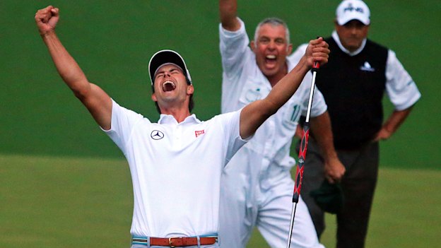 Adam Scott and caddie Steve Williams celebrate the winning putt.