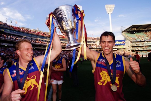 Michael Voss and Simon Black celebrate another of the three premierships wins in the 2000s.