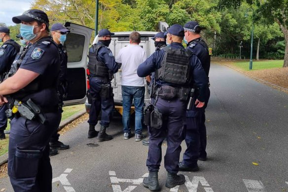 Police arrest one of the demonstrators this morning.