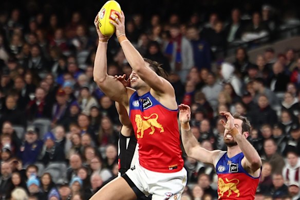 Sam Draper of the Lions marks the ball.