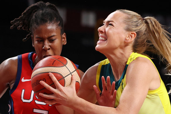 Australia’s Tess Madgen drives to the basket against Ariel Atkins.