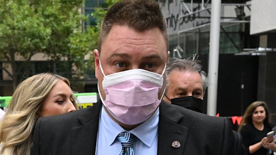Brett Johnson (centre) departs from the County Court of Victoria in Melbourne on Wesdnesday.