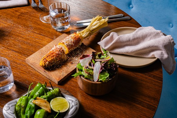 Charred corn on the cob with parmesan and lemon aioli. 