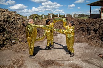 The material used in the gold suits is also known as mylar, used for emergency or space blankets.