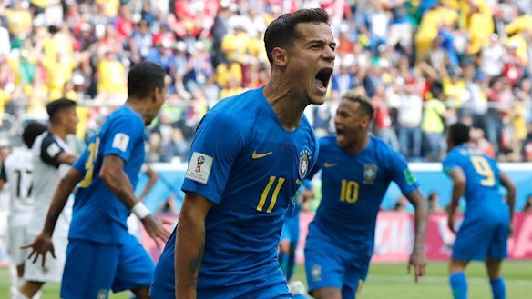 Leaving it late: Philippe Coutinho celebrates his injury time goal.