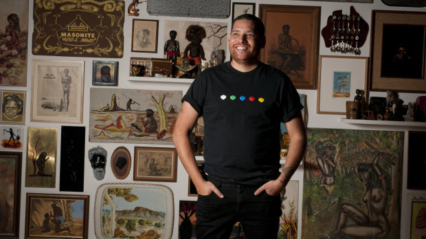 Artist Tony Albert in front of his exhibition at the Queensland Art Gallery. 