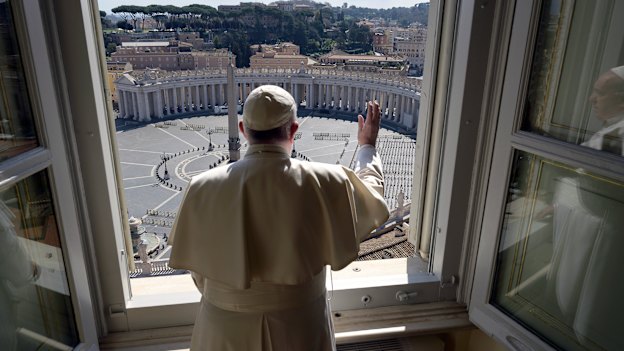 Pope Francis delivers his blessing from inside the Apostolic Library at the Vatican on Sunday.