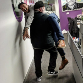 Who's carrying who? Bruno Bouchet gets a helping hand from his boss, Kyle Sandilands.
