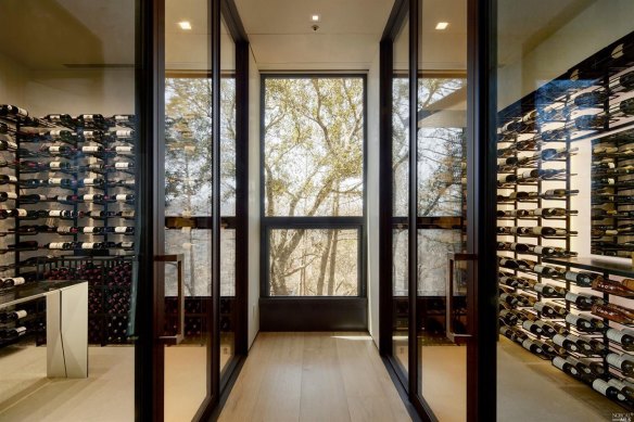 The wine library is bathed in light.