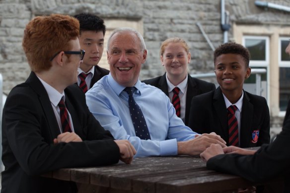 Principal of Westbourne College Sydney, Ken Underhill, with students of Westbourne School, UK.