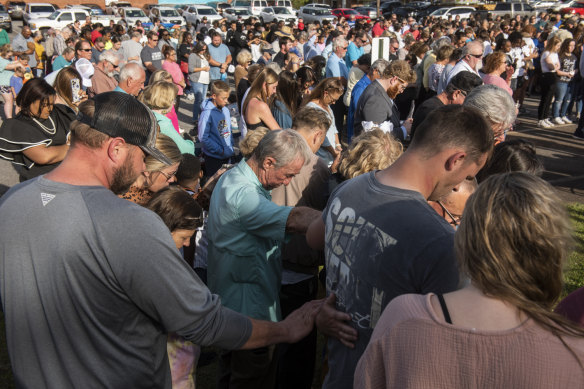 Community members pray during a vigil at First Baptist Church in Dadeville, Alabama, on April 16, after a deadly shooting at Mahogany Masterpiece dance studio in Dadeville.