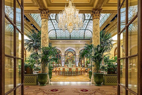 The grand stained-glass dome looms above The Palm Court at The Plaza Hotel.