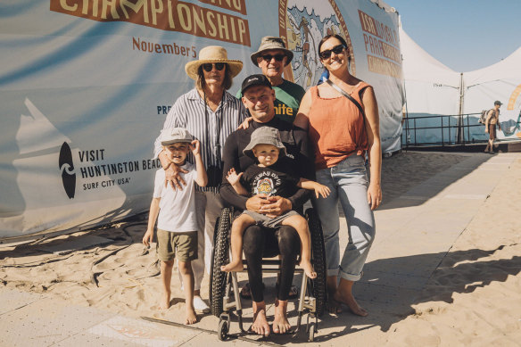 Taylor with his parents Desley and Peter, wife Lorin and children Jay and Sunny at the World Para Surfing Championship in November.