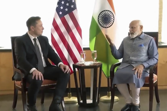 Tesla and SpaceX CEO Elon Musk, left, with Indian Prime Minister Narendra Modi.