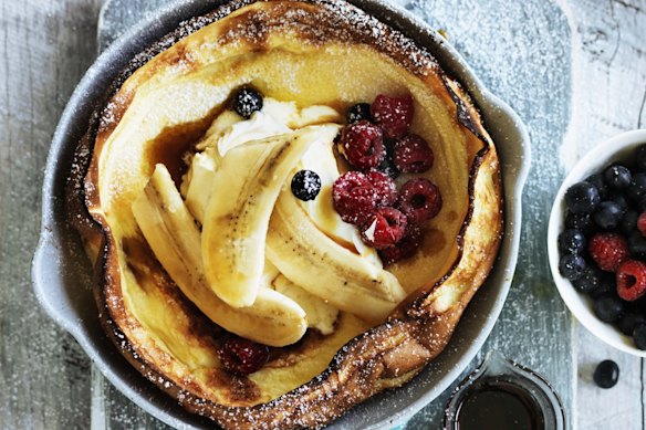 Dutch baby with bananas and berries.