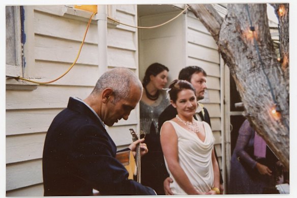 Musician Paul Kelly (left), a friend of Lacy’s, performed at her Australian wedding in 2002 – two years after she married Ole Sturm (right) in LA.