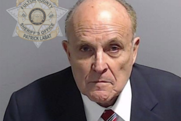 Rudy Giuliani was charged alongside Donald Trump and 17 others accused of scheming to subvert the will of Georgia voters to keep the Republican president in the White House.