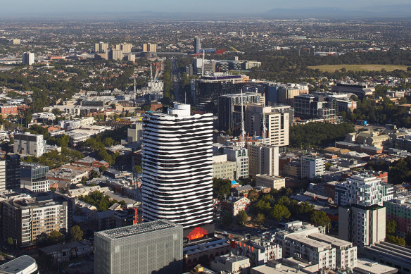 Barak’s image towers over Swanston Street on the facade of a Melbourne apartment building.