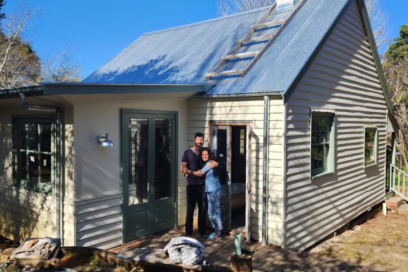 Olivia George and partner Rowan in their Blue Mountains cottage.