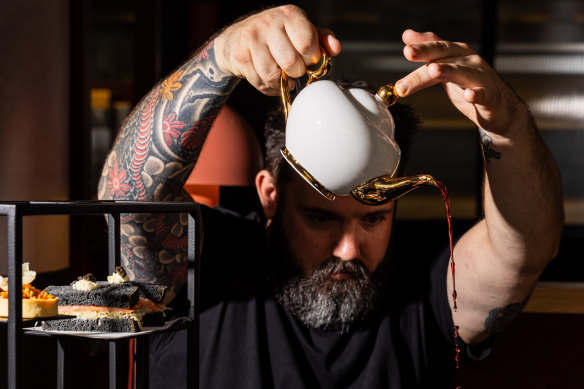 QT Newcastle executive chef Shayne Mansfield’s high tea includes duck-leg croquettes, Victoria sponge cake and lamb merguez sausage rolls served with his grandmother’s secret ketchup.