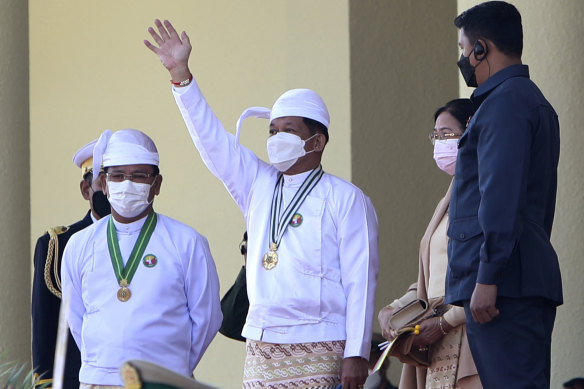Senior General Min Aung Hlaing, centre, head of the military council, waves during the ceremony marking Myanmar’s 75th anniversary Union Day in Naypyitaw on February 12.