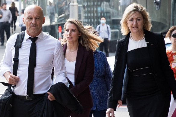 Gary Jubelin, former investigator on the William Tyrell disappearance, arrives at Downing Centre Local Court on Tuesday with his legal team including barrister Margaret Cunneen SC, right.