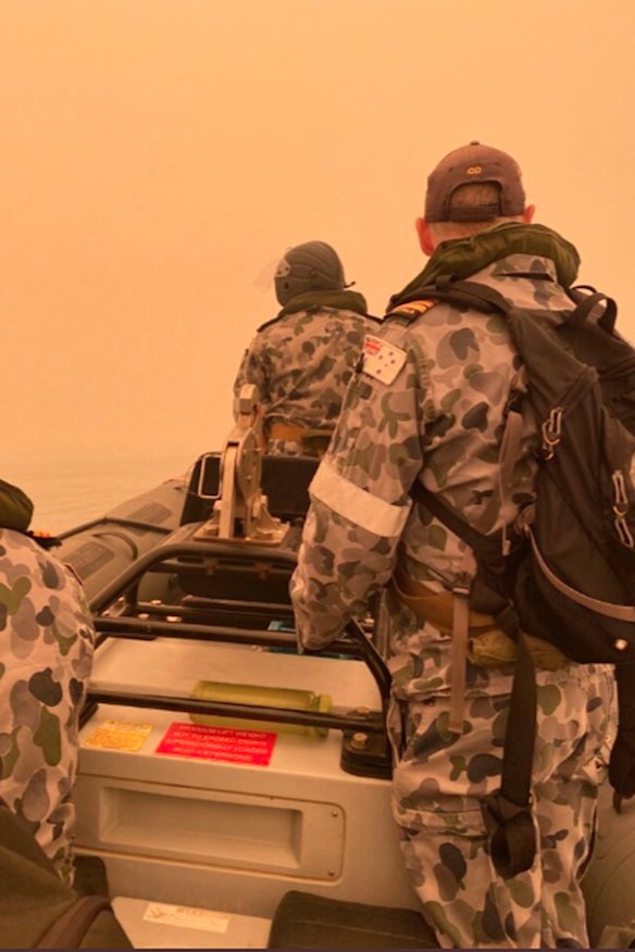 HMAS Choules Commander Scott Houlihan leads a liaison team to meet with community leaders in Mallacoota.