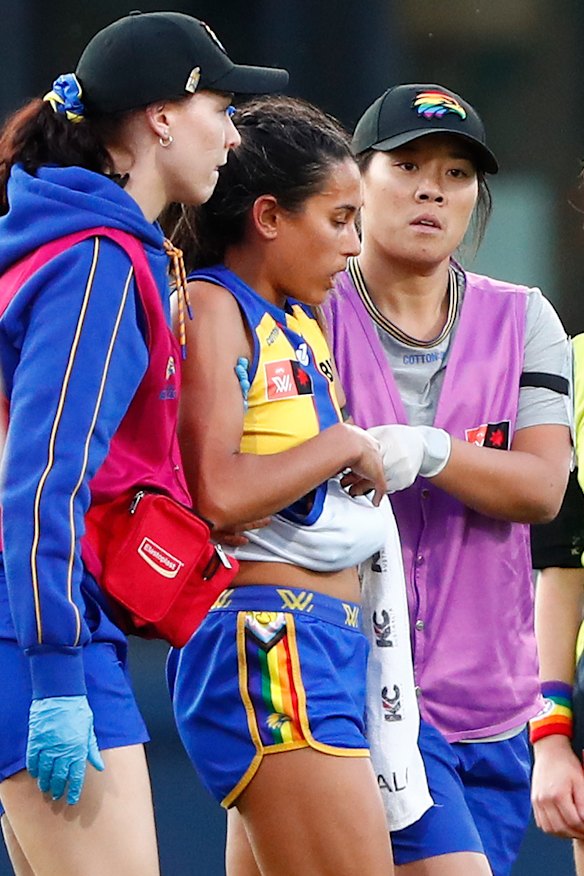 Mikayla Western is helped from the field.